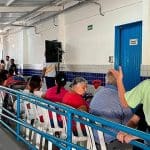 Imagem pessoas aguardando atendimento no programa Mais Justiça