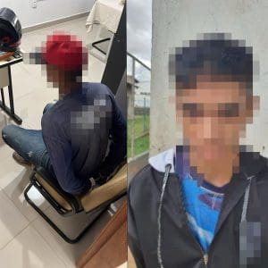 Imagem borrada de dois suspeitos presos pela policia