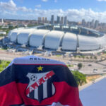 Imagem Arena das Dunas e camisa do Anápolis Futebol Clube