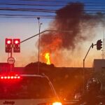 Imagem fogo e fumaça preta visto a distância