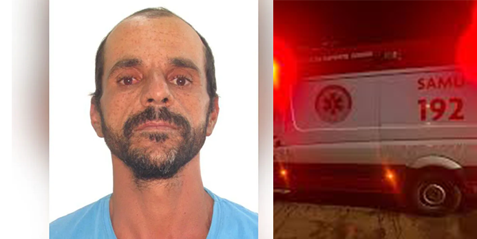 Imagem homem de barba e camisa azul ao lado uma ambulância de SAMU