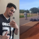 Imagem jovem camisa preta segurando celular ao lado corpo estendo na rodovia