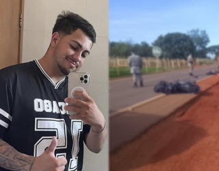 Imagem jovem camisa preta segurando celular ao lado corpo estendo na rodovia