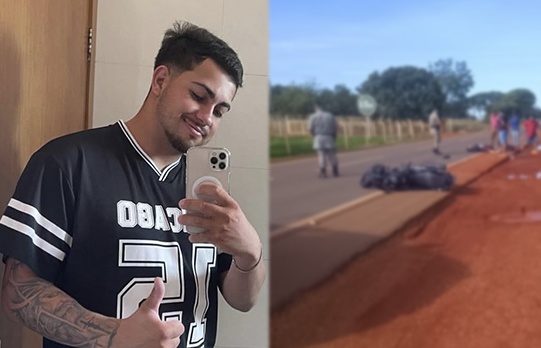 Imagem jovem camisa preta segurando celular ao lado corpo estendo na rodovia