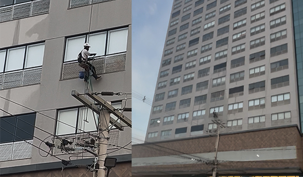 Imagem trabalhador suspense limpando prédio