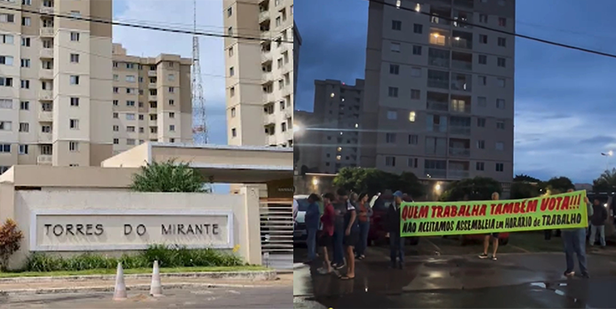 Imagem predio ao lado pessoas segurando uma faixa em protesto