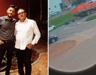 Imagem dois homens abraçados ao lado rodovia com acidente