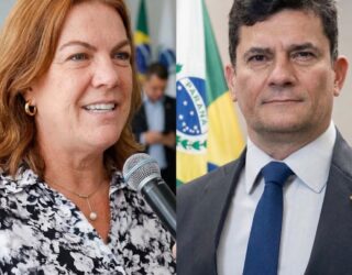 Imagem de Sérgio Moro, usando terno e gravata. Ao lado Fátima Gavioli, ruiva, olhos claros e uma camisa estampada em preto, cinza e branco, com um microfone na mão.